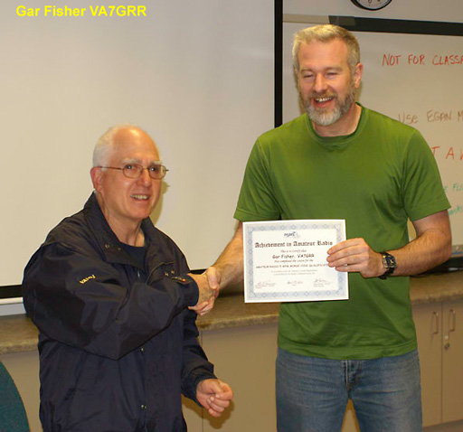 Gar Fisher VA7GRR receiving the 5 wpm Morse Code Award. Photo: Leif Erickson VA7CAE.
