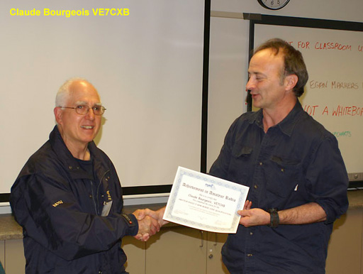 Claude Bourgeois receiving the 5 wpm Morse Code Award.  Photo: Leif Erickson VA7CAE.